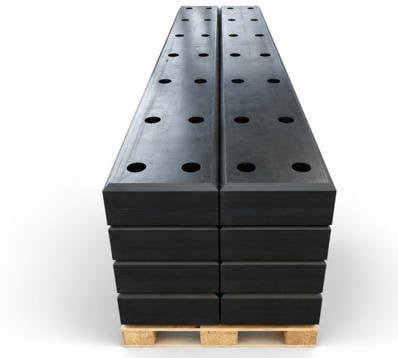 UHMWPE synthetic plastic sleepers installed on mainline railway track -- heavy-haul freight line with steel rail fastening